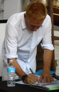 Jonathan Staples signs for his purchase.