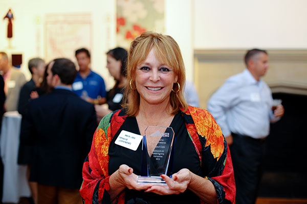 Debbie Johnston, owner and CEO of All About Care (No. 25) with her award.