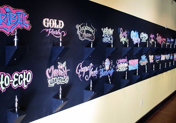 A tasting wall lets customers try flavors using disposable mouthpieces. (Photos by Michael Thompson)