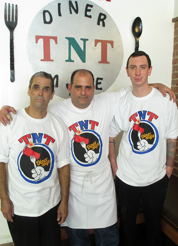 TNT chef Rafael Nieves, owner Tommy Sotos and manager Justin Goodwin.