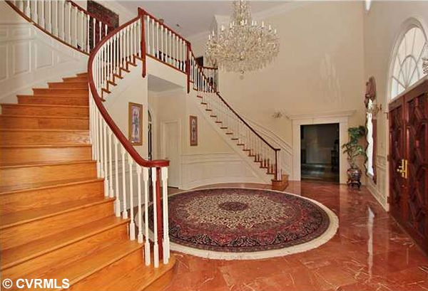 The house's foyer features a large chandelier. (Photos courtesy of CVRMLS)