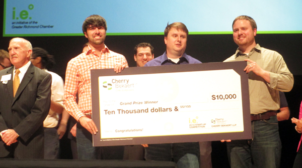 Tenant Turner accepts the $10,000 check for wining the startup contest. (Photo by Michael Thompson.) 