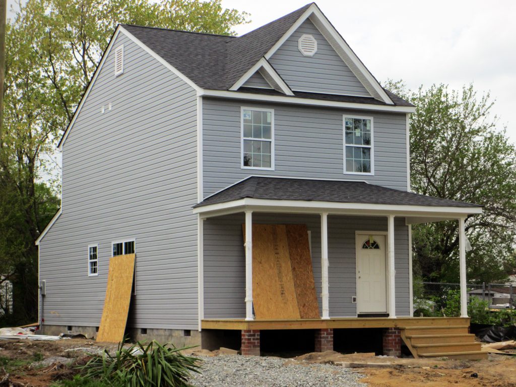 The new homes will have a similar design to a home by the same developer across the street. Photo by Jonathan Spiers.