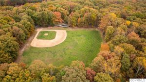 The property includes a private baseball diamond. 