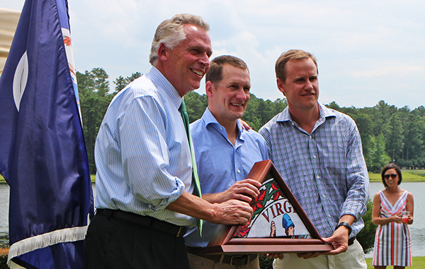 From left: Gov. Terry McAuliffe presents Hardywood founders Patrick Murtaugh and Eric McKay with a state flag. Photos by Jonathan Spiers.