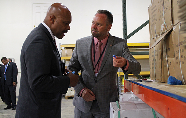 Virginia Secretary of Commerce and Trade Maurice Jones (left) is shown Detectamet products by company Chairman Sean Smith. Photos by Jonathan Spiers.</em.