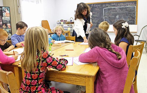 Susana Mulcahey works with elementary school students at Heartwood Grove. Photos by Katie Demeria.