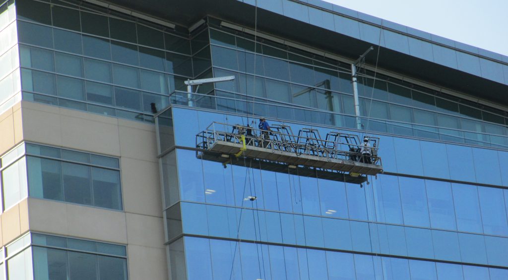 Crews take down the MWV lettering on its headquarters building. Photos by Jonathan Spiers.