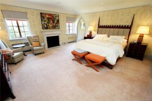 The master bedroom suite has a granite fireplace. 