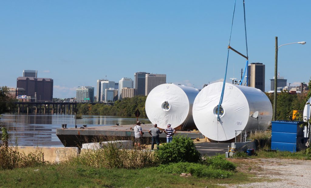 Crews unload several massive Stone Brewing tanks from a river barge Wednesday. Photos by Michael Thompson.