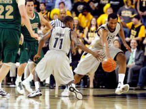 Brandenberg (left) and Haley make a play during a VCU basketball game. 