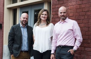 Matt Isner, left, and Matt Fidler with Caryn Foster Durham at CRA's Richmond office.