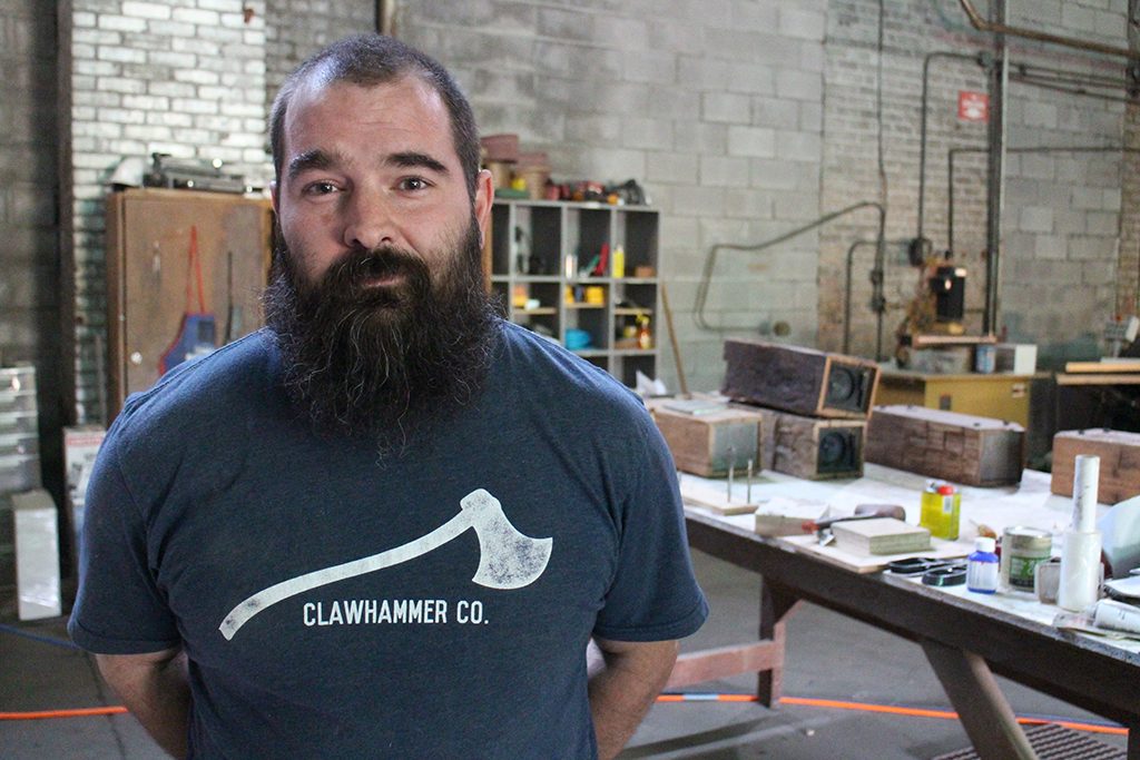 Zachary Jester said his ClawHammer shirt reminds him everyday of what he owes his donors. Photos by Michael Thompson. 