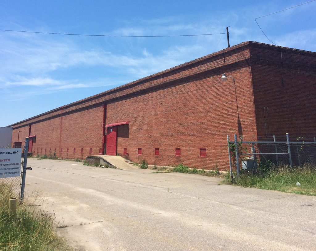 Developers plan to convert the former tobacco warehouse at 1650 Overbrook Road into as many as 117 apartments. (Kieran McQuilkin)