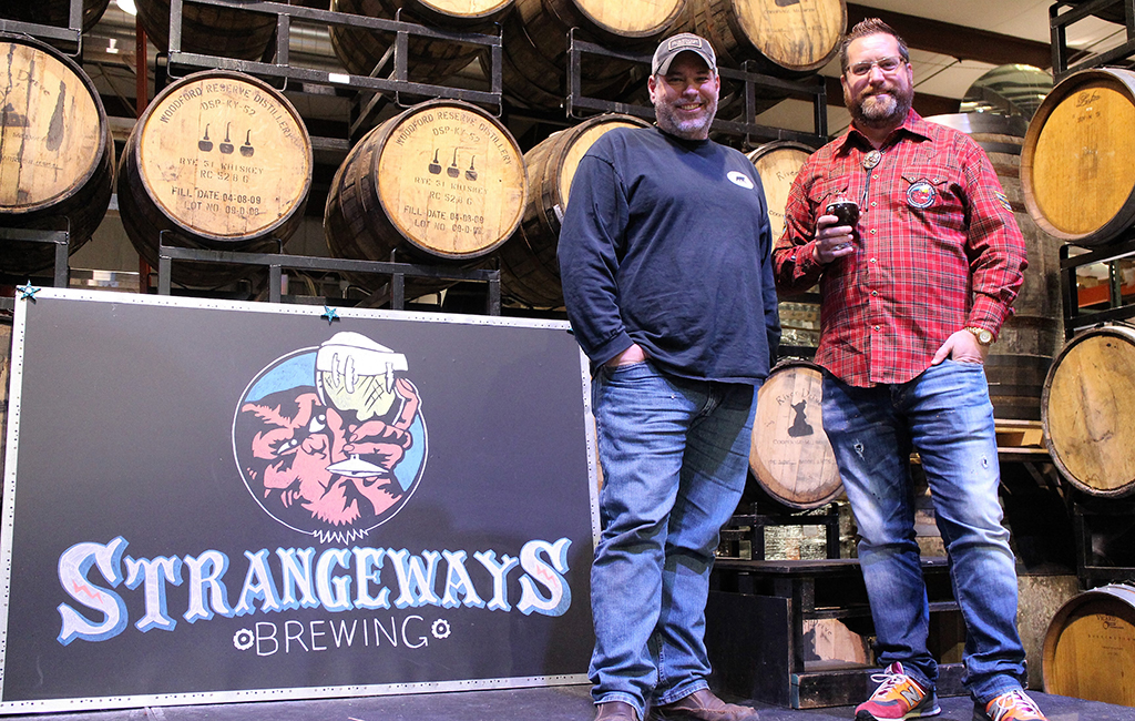 Neil Burton (right), founder of Strangeways Brewing, stands with master brewer Mike Hiller at its brewing facility in Henrico. (J. Elias O'Neal).