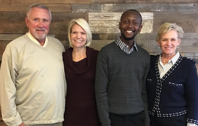 Scholarship recipient Eric Enninful with Brandcenter managing director Don Just, left, and Spurrier president Ingrid Vax and CEO Donna Spurrier, right. 