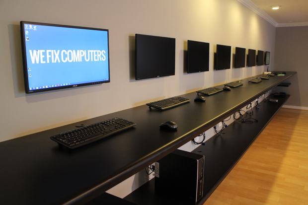 The interior of ALB Tech's new space is decked out computer terminals and a couple of big screens. 