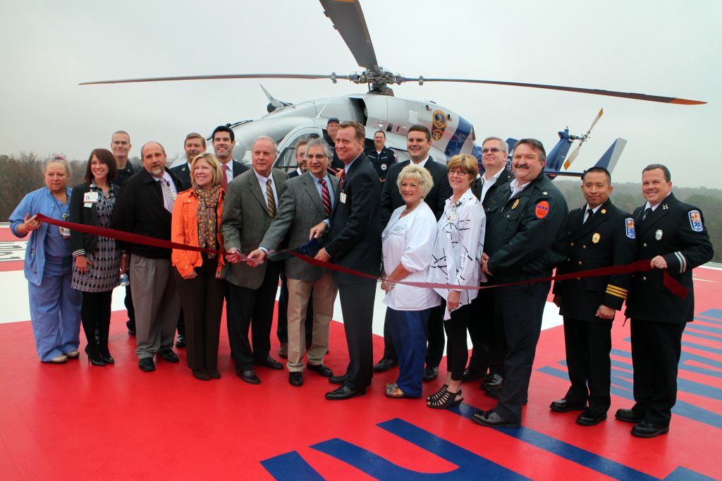 Chippenham and Johnston-Willis hospitals CEO Tim McManus (center) cuts the ribbon on a new helipad. Photos by Katie Demeria.