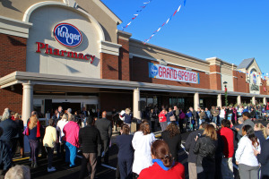 Shoppers wait for the official opening of the expanded store. 